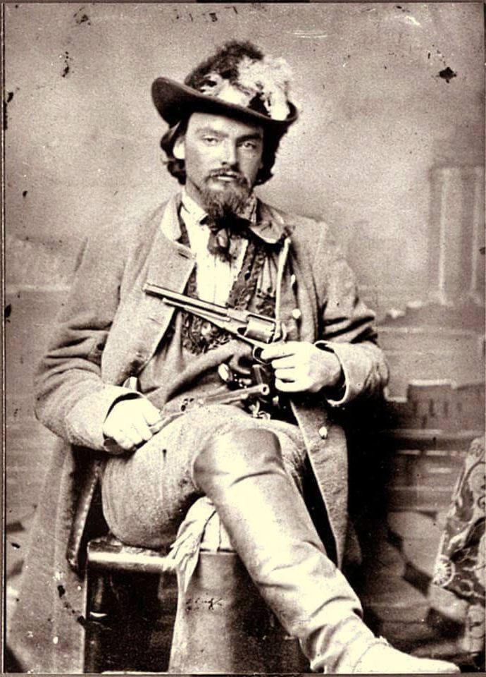 Confederate Guerrilla George Maddox of the Quantrill Raiders with his revolvers. c1863